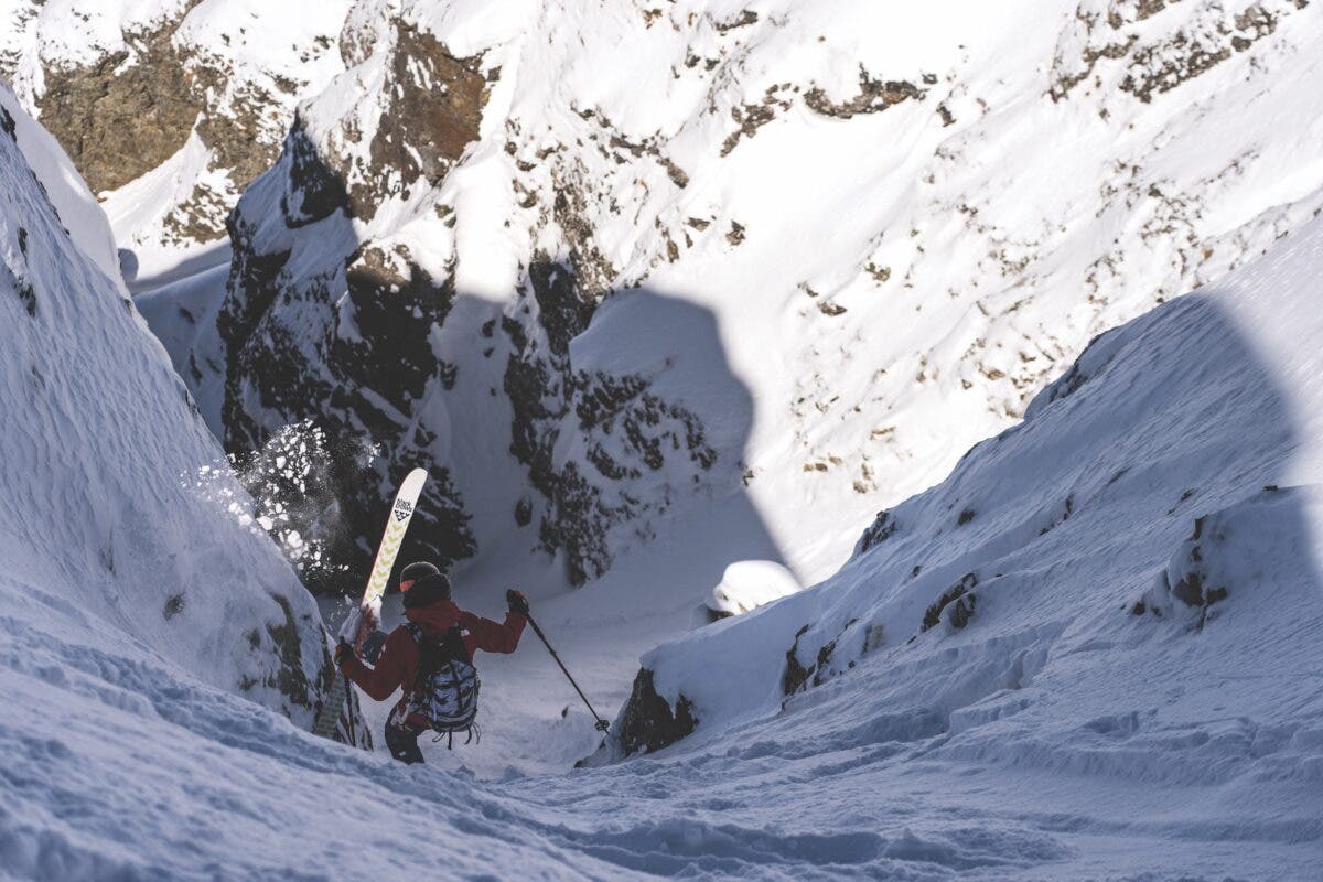 Skier in a steep chute