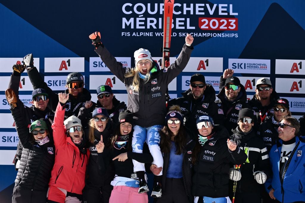 Mikaela Shiffrin celebrates with her team and coaches