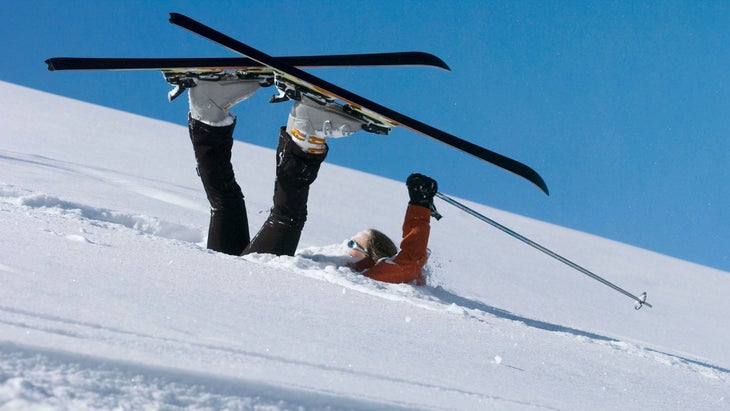 Woman skier fallen in powder