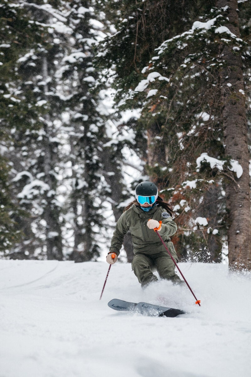 Skier in powder on all-mountain skis