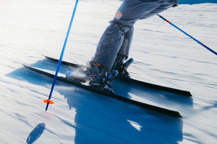 Skier wearing the all-new Lange Shadow ski boot