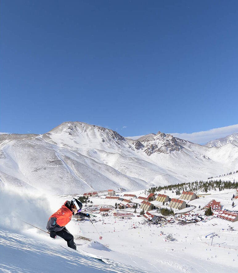 Skier heads toward village in Las Lenas