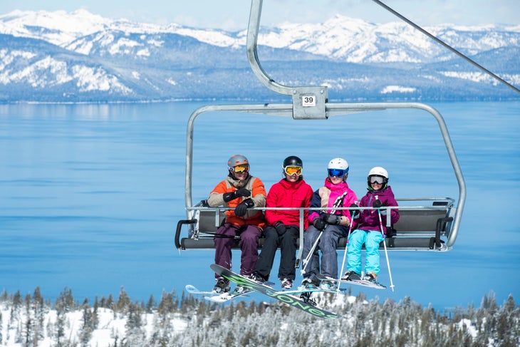 A family riding a chairlift at a resort in Lake Tahoe