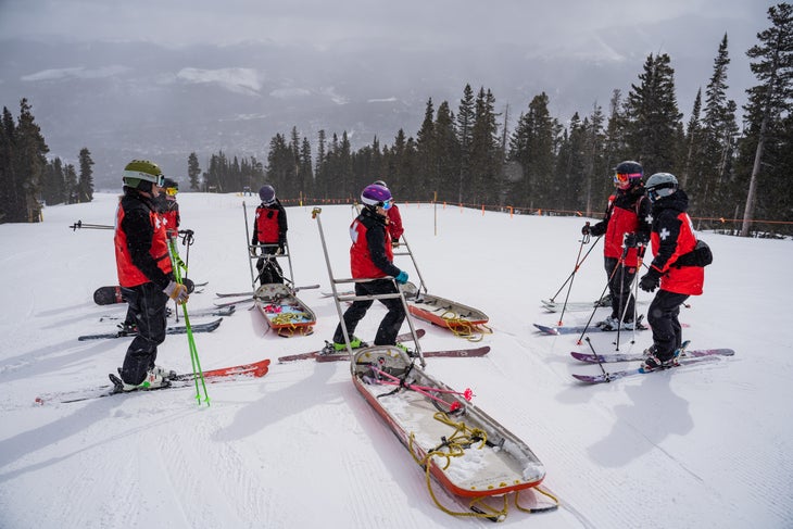 ski patrollers with toboggan