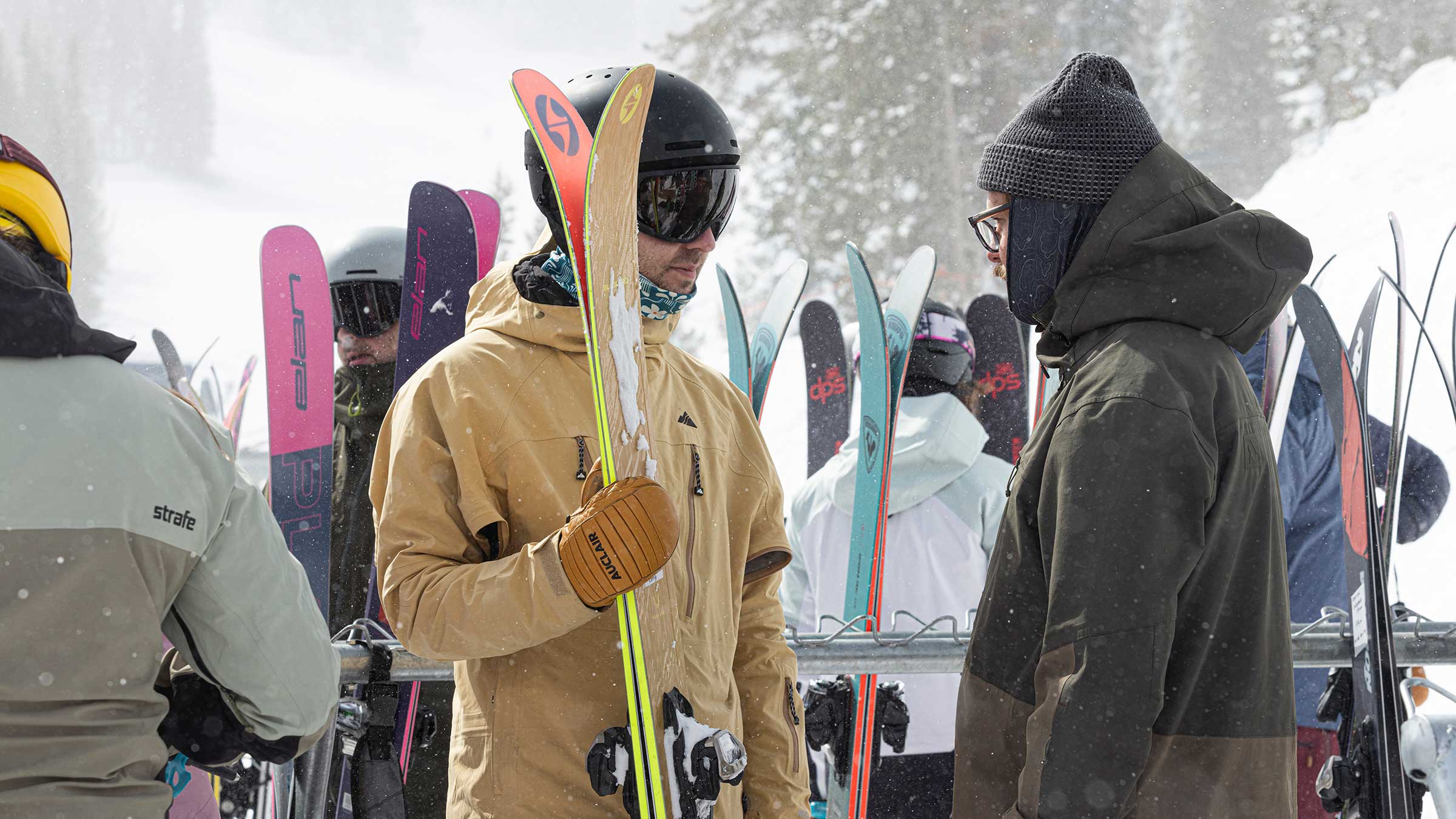 Ski tester pulls an all-mountain ski off the rack at Ski Test