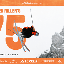 Orange border with skier mid air. Big 75 in orange font.