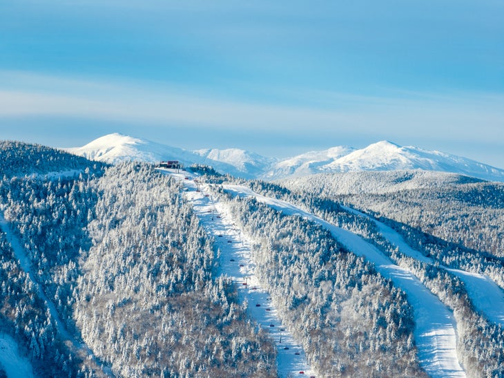 Blue skies overlooking snow covered runs at Sunday River in Maine