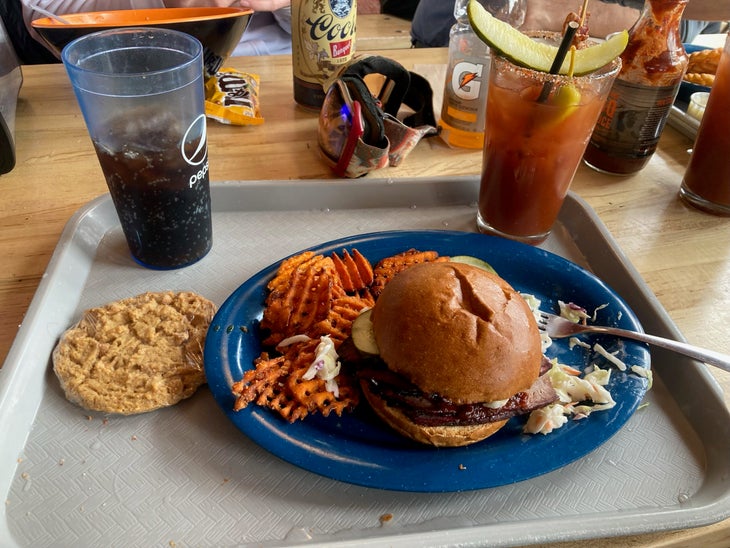 Blue plate with a burger on it.