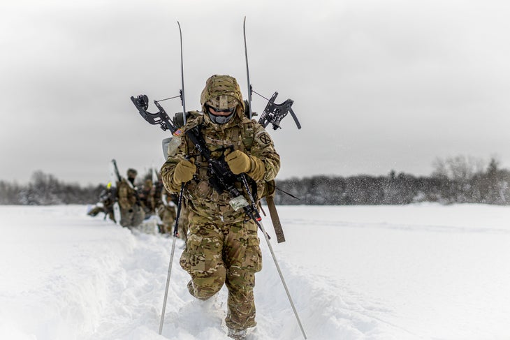 Soldiers running through snow