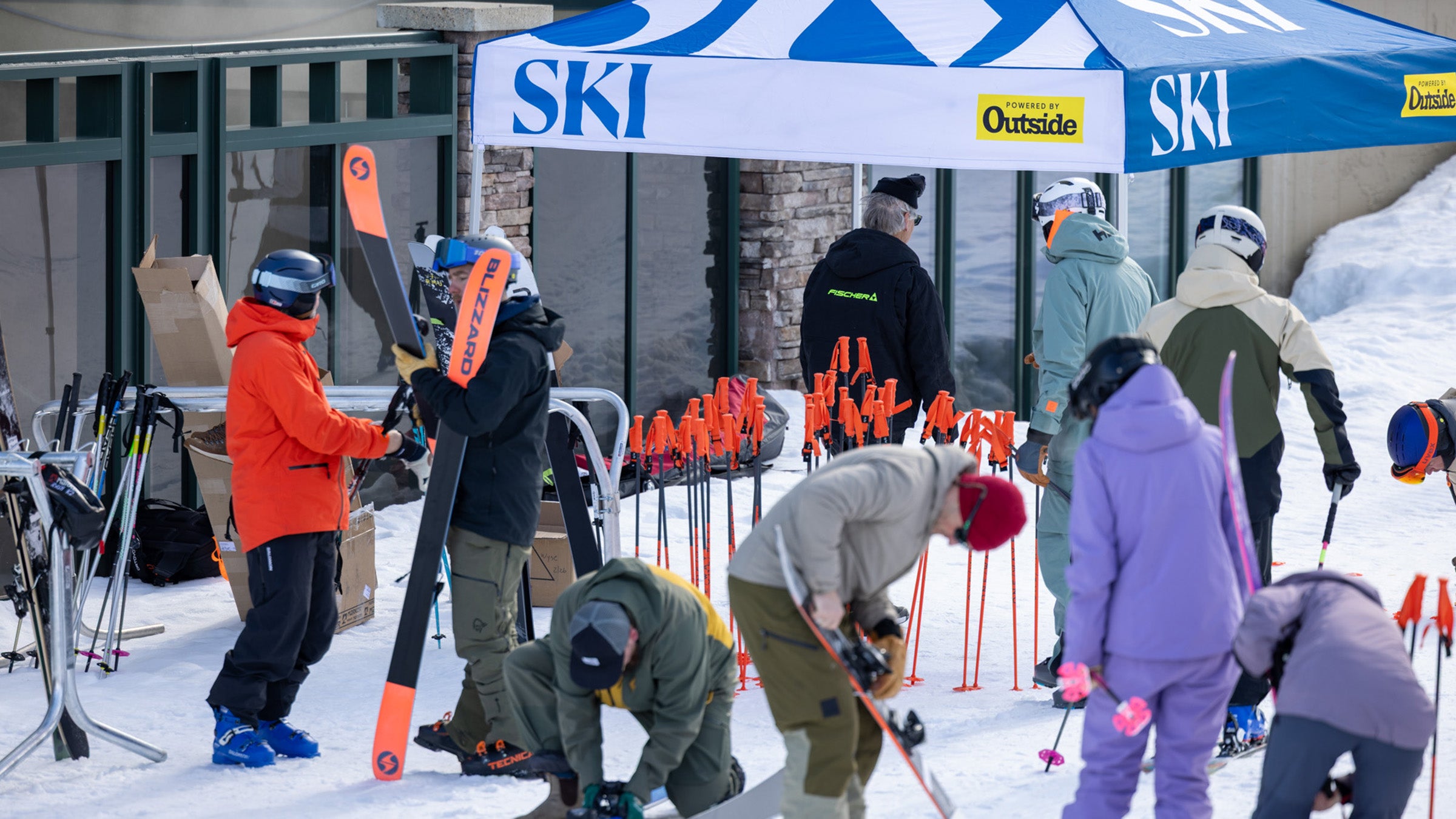 Ski testers adjusting skis at Big Sky base for 2025 SKI Test