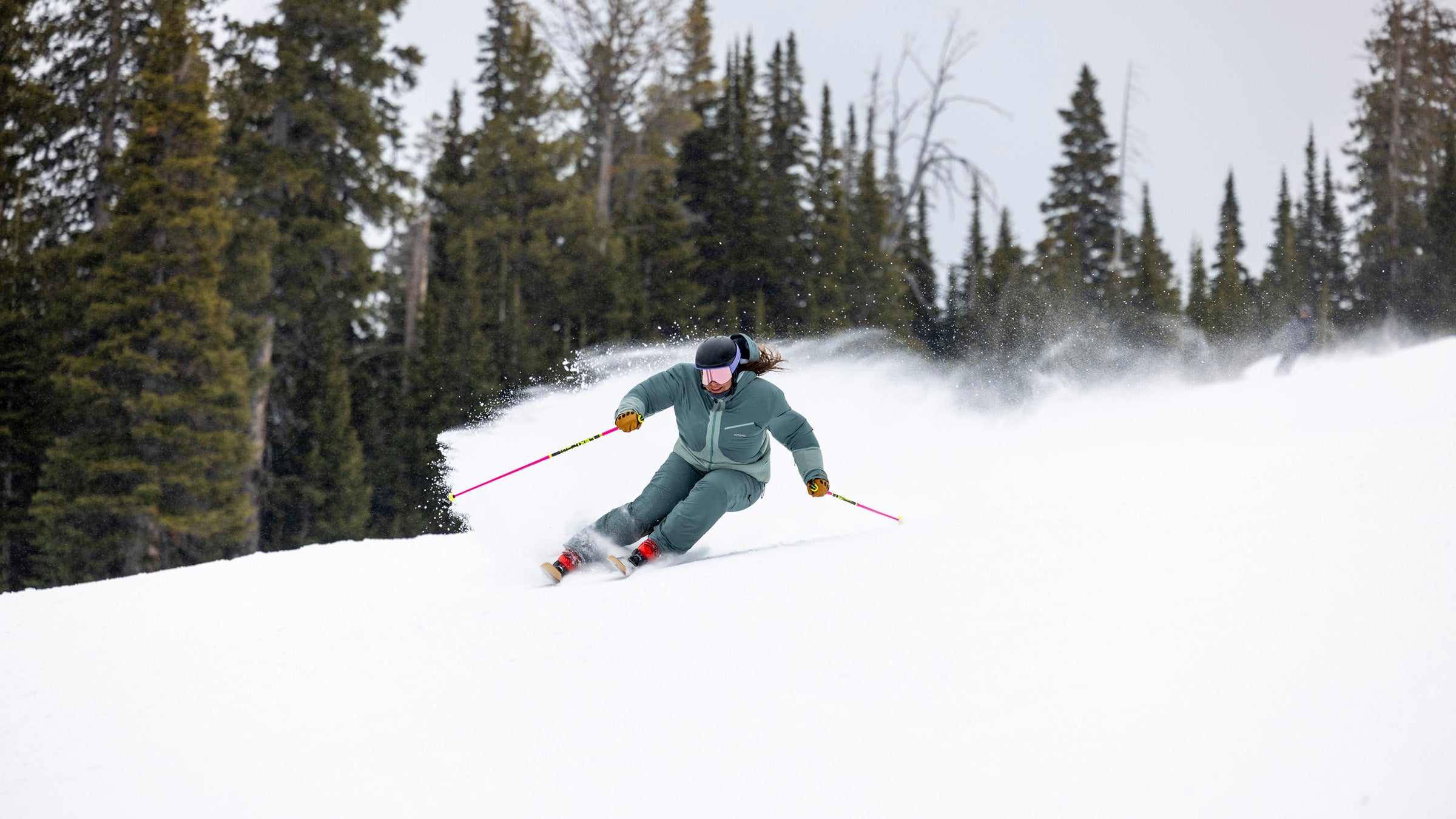 Tester Zoe Mavis, a professional ski instructor at Big Sky, carves on a pair of mountain skis to test their edge hold. 