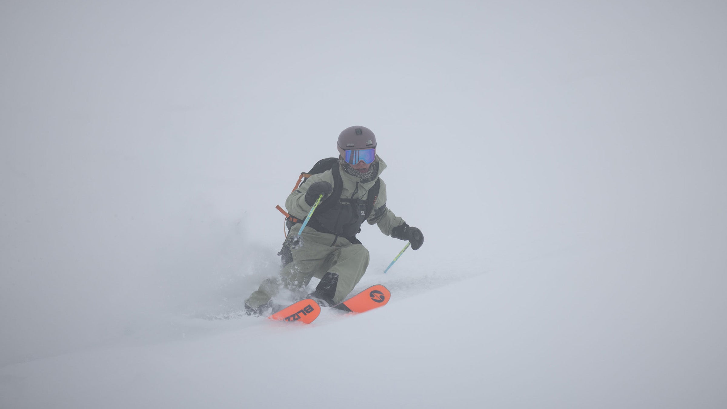 Skier making turn through powder snow