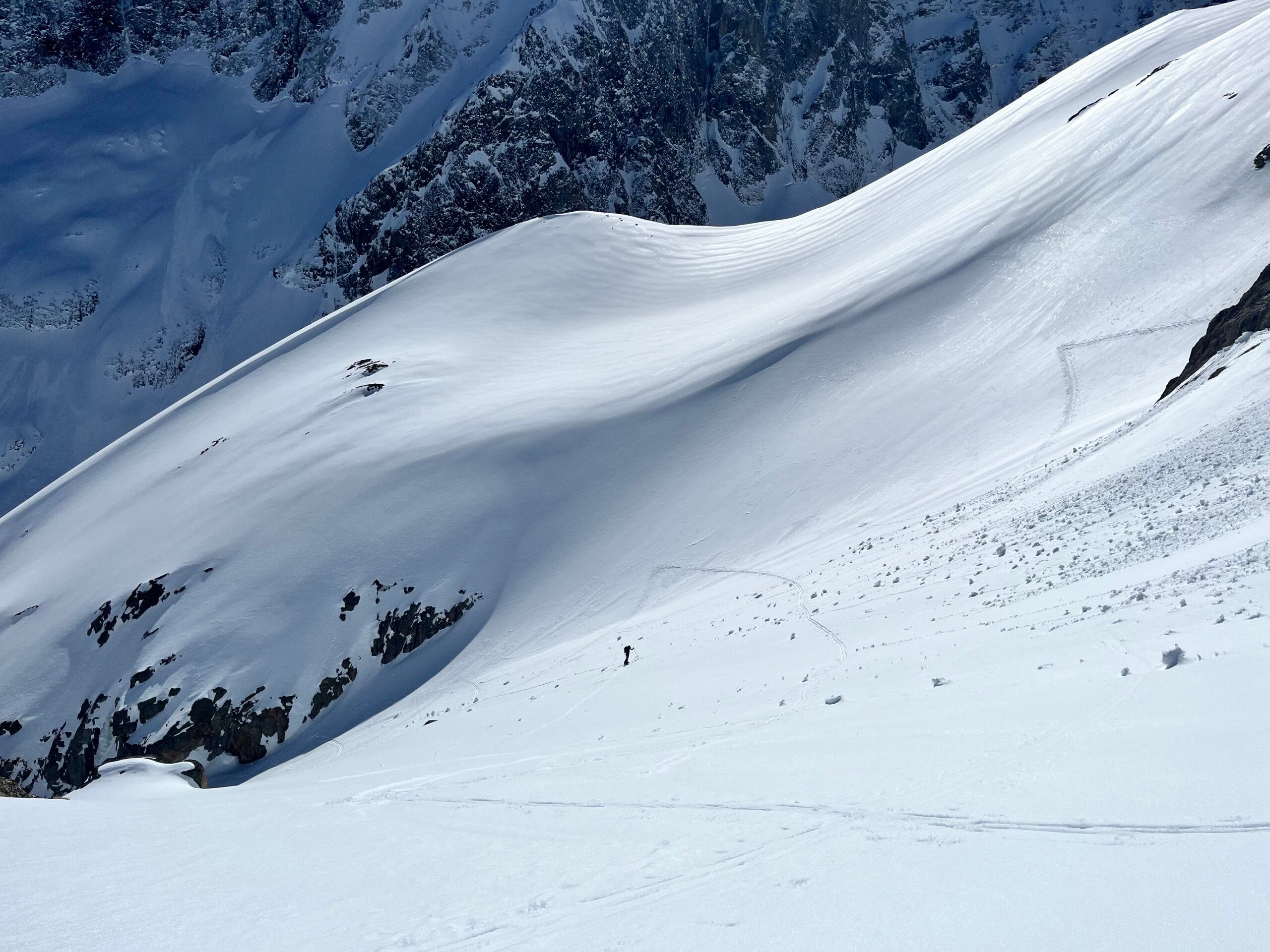 wide shot of skier against blue sky