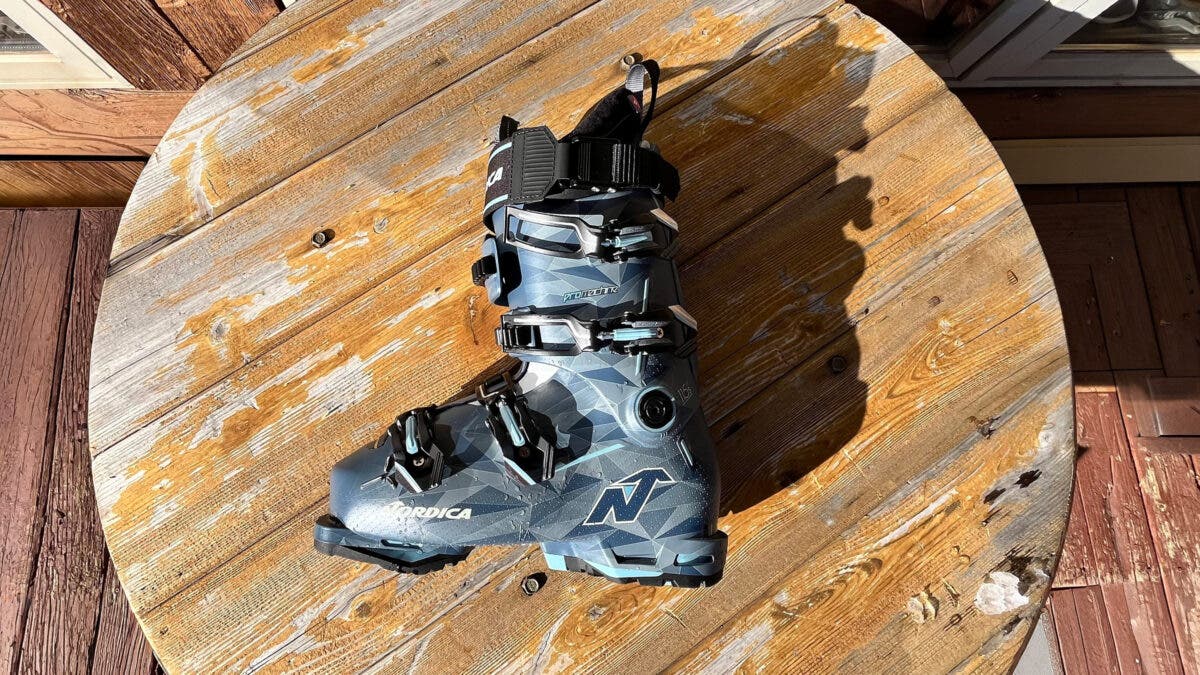 Closeup of Nordica Promachine 3 S 115 W ski boot on wooden table