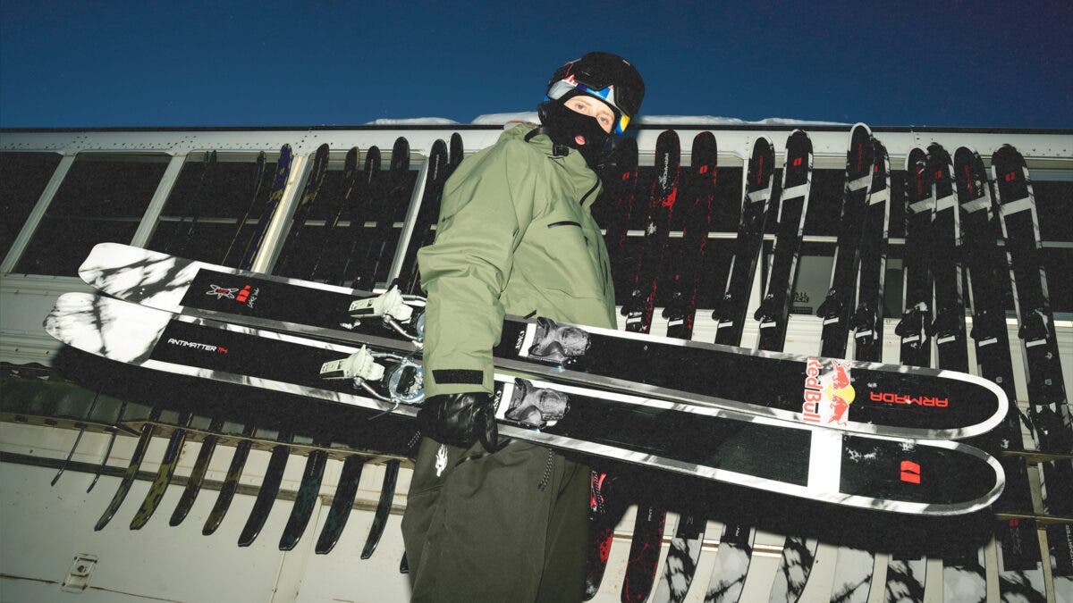 Skier Max Palm posing with Armada Antimatter 114 in front of Silverton bus