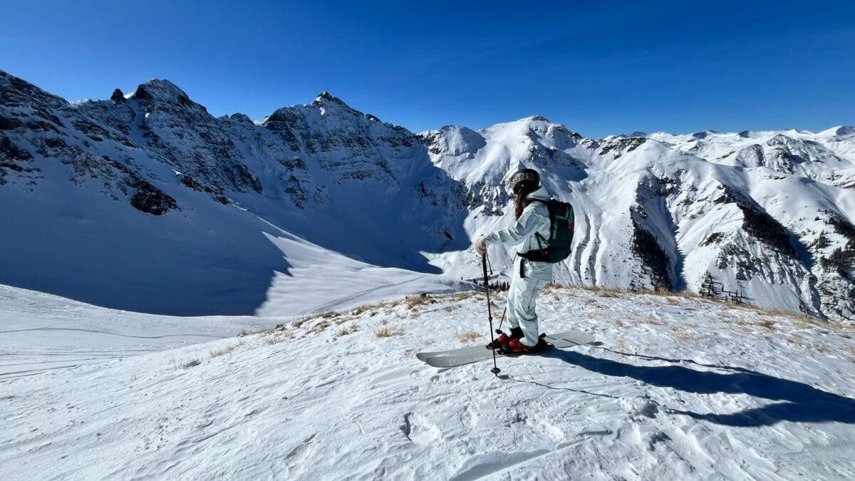 Skier standing on Armada Antimatter skis with Silverton Mountain in background