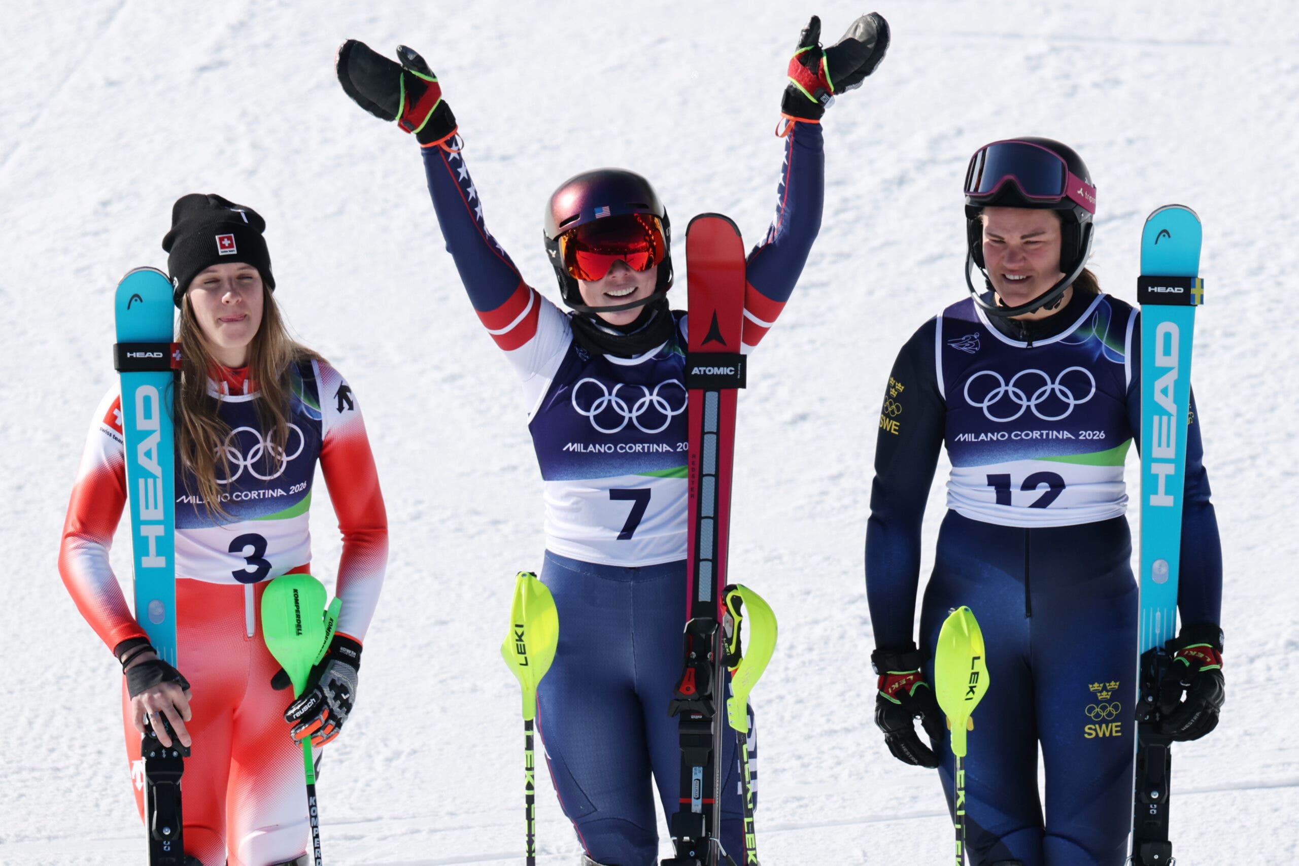 EBRUARY 18: Gold medalist Mikaela Shiffrin of Team United States, Silver medalist Camille Rast of Team Switzerland and Bronze medalist Anna Swenn Larsson of Team Sweden pose for a photo in the finish area during the Women's Slalom Run on day twelve of the Milano Cortina 2026 Winter Olympics at Tofane Alpine Skiing Centre on February 18, 2026 in Cortina d'Ampezzo, Italy. (Photo by Mattia Ozbot/Getty Images)