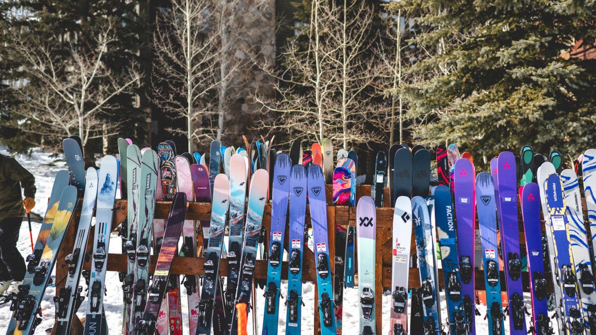 All mountain skis lined up on ski rack at 2027 SKI Test at Deer Valley