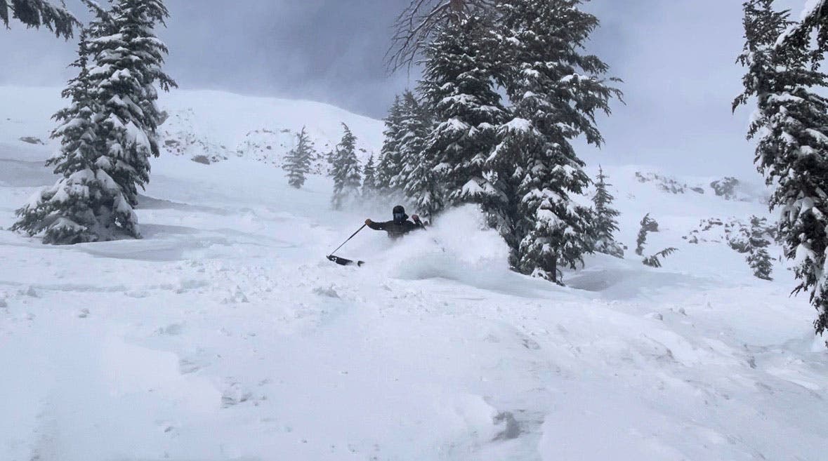 Skier on Fisicher Nothing powder ski in deep snow