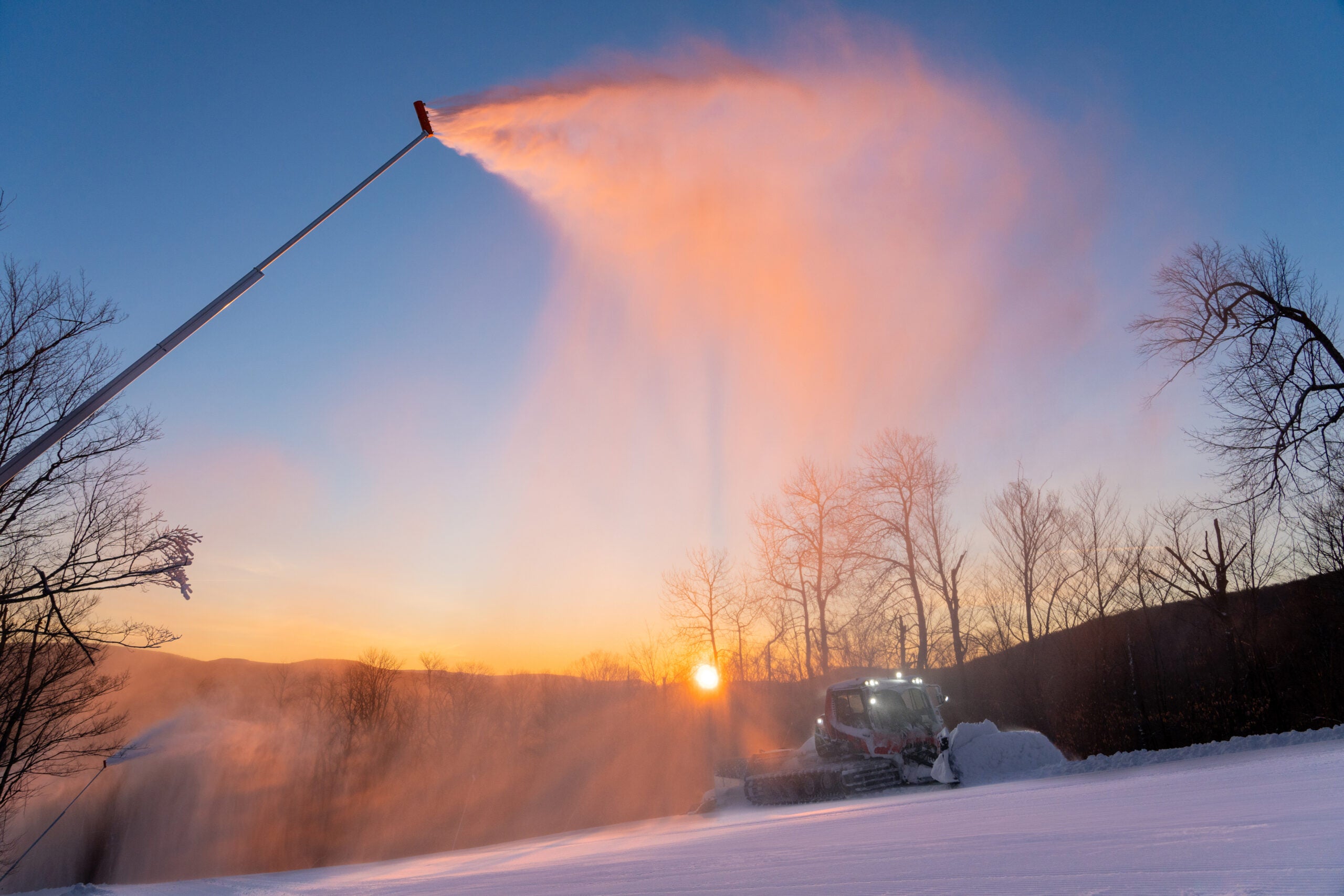 sunrise with ski groomer